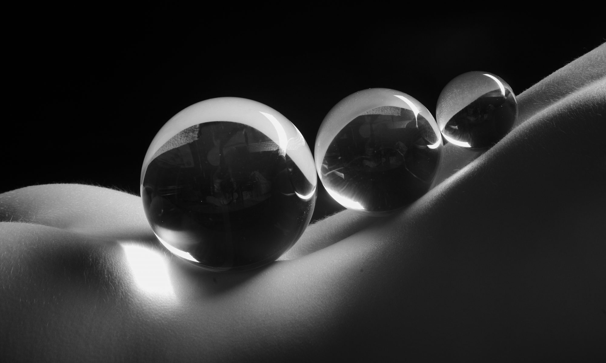 Three Crystal Balls on a Woman's Back